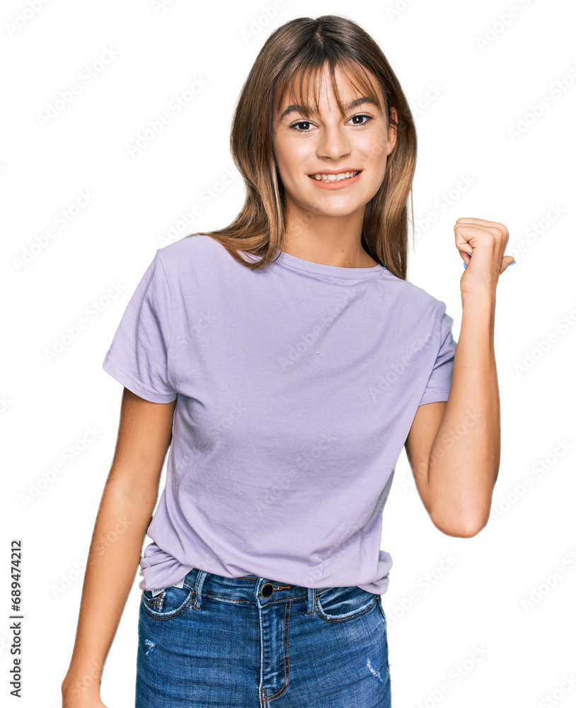 Teenager caucasian girl wearing casual clothes smiling with happy face looking and pointing to the side with thumb up. Teenager caucasian girl wearing casual clothes smiling with happy face looking and pointing to the side with thumb up.
