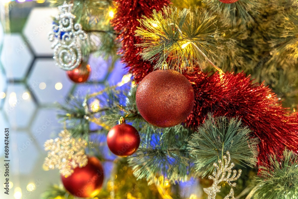 Background with blur on the theme of Christmas or New Year with toys and shining elements