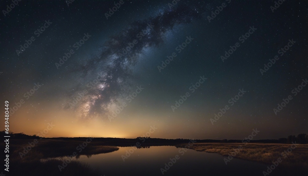 Milky Way over the river at night. Starry sky.