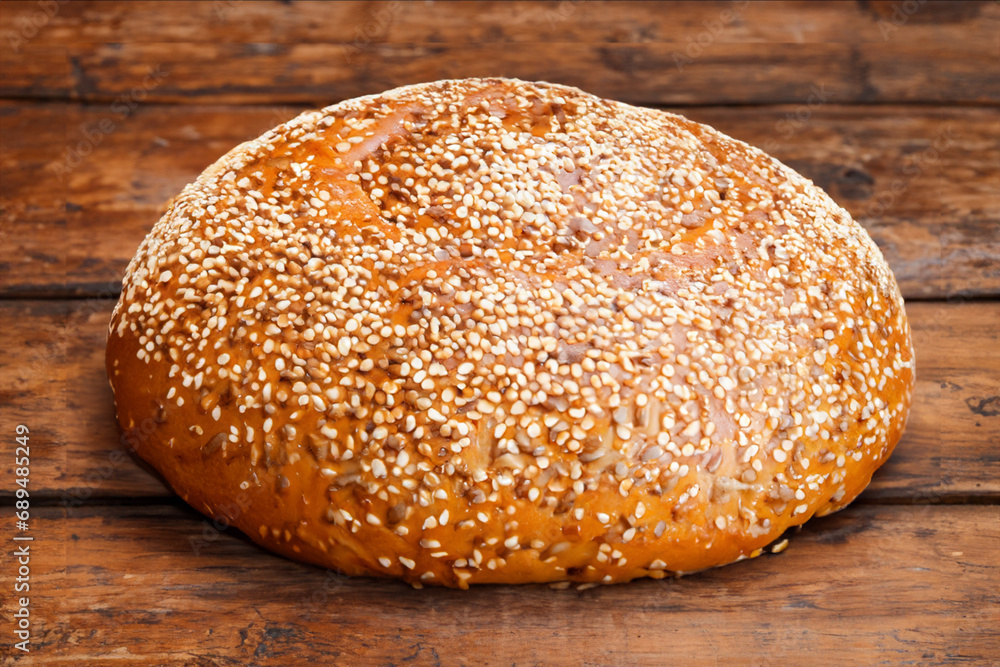 Artisan bread on wooden table Artisan bread on wooden table