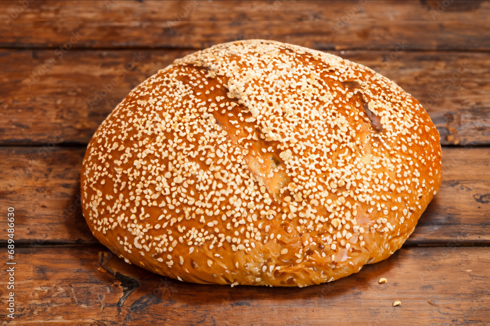 Artisan bread on wooden table Artisan bread on wooden table