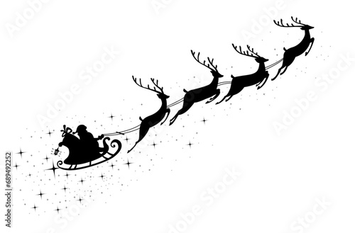 Silhouette of Santa Claus riding in a sleigh with reindeer photo