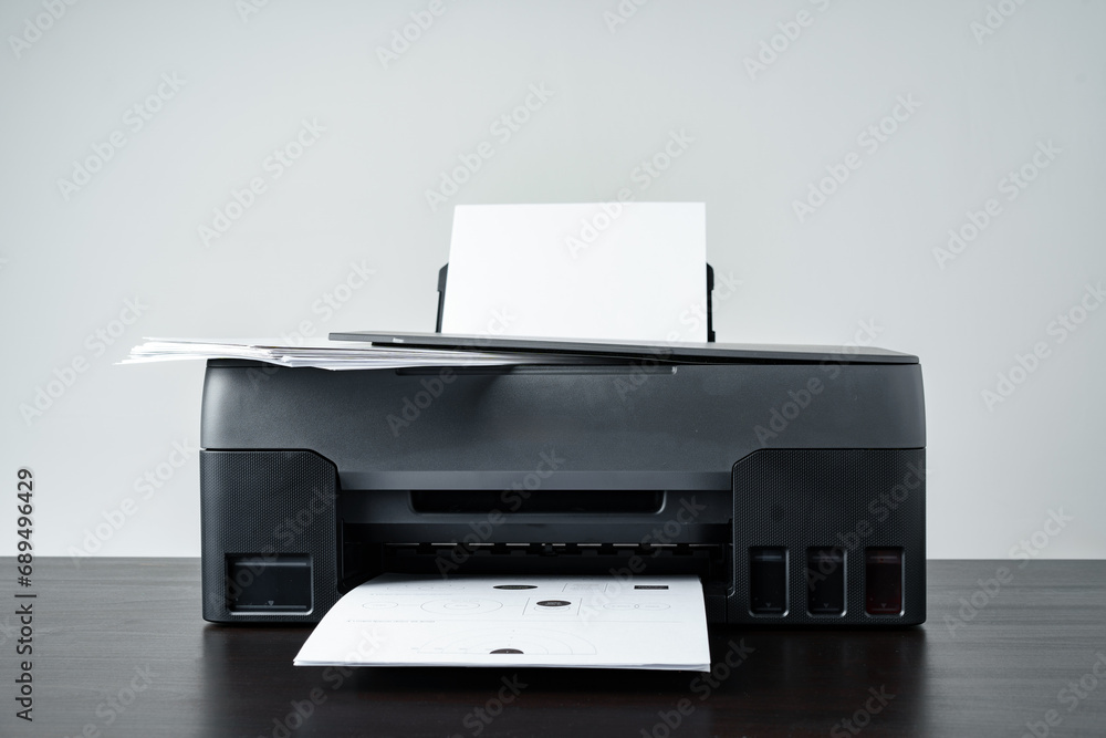 Printer with paper on gray background close up Printer with paper on gray background close up