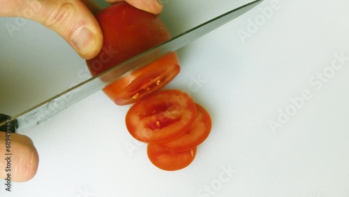 A Close-Up of Tomato Slicing
