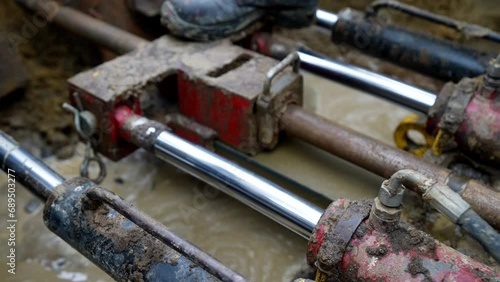 Wallpaper Mural hydraulic automatic equipment for installation gas pipes in ground, closeup view inside trench Torontodigital.ca