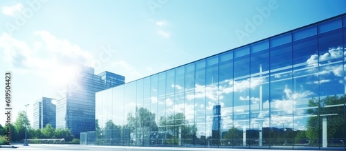 Glass modern building with reflection, stock footage. Beautiful glass facade with landscape reflection.