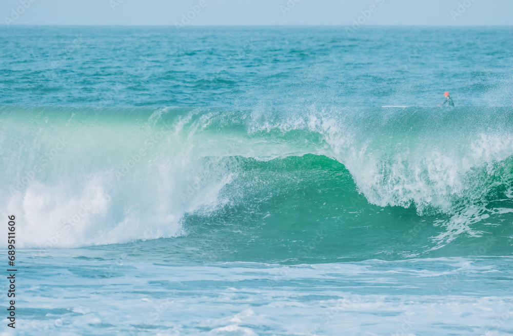 Fototapeta premium Wave splashing close-up. Crystal clear sea water, in the ocean in San Francisco Bay, blue water, pastel colors.