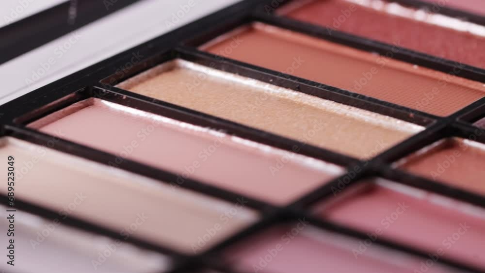 Modern trendy set of eye shadows on a white background. Soft texture of shadows with a powdery tint. High-quality cosmetics for girls, close-up, slider Modern trendy set of eye shadows on a white background. Soft texture of shadows with a powdery tint. High-quality cosmetics for girls, close-up, slider