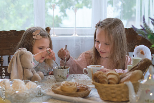 Embracing heritage: Sisters in a rural backdrop, delving deep into the English tea culture, surrounded by vintage elegance
