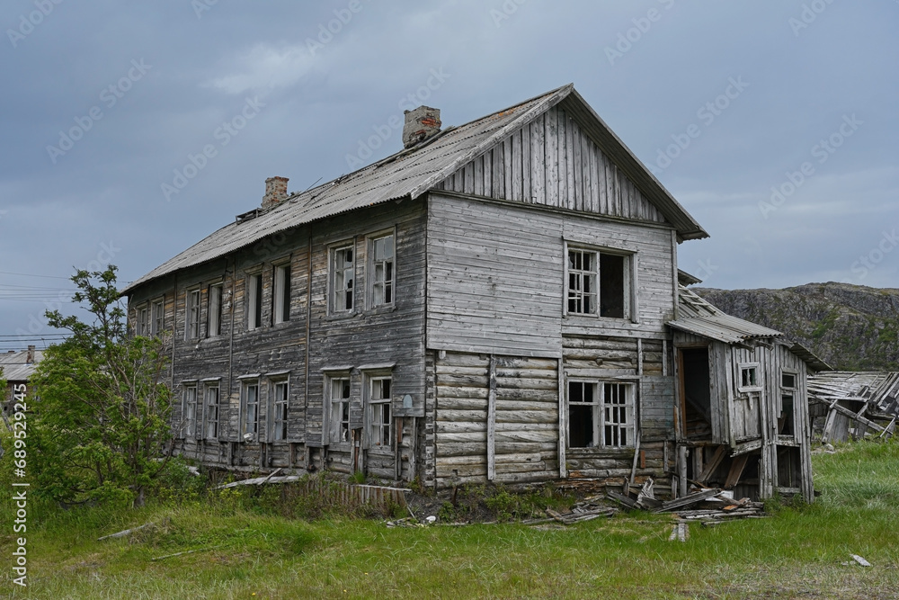 Traditional northern ruined wooden houses in Teriberka, Murmansk region, Russia Traditional northern ruined wooden houses in Teriberka, Murmansk region, Russia