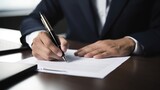 Businessman signing a contract in office. Close-up of business man signing contrac