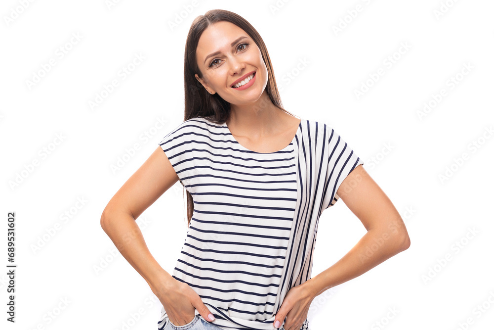 young cheerful energetic caucasian brunette woman in a striped t-shirt smiling on a white background with copy space