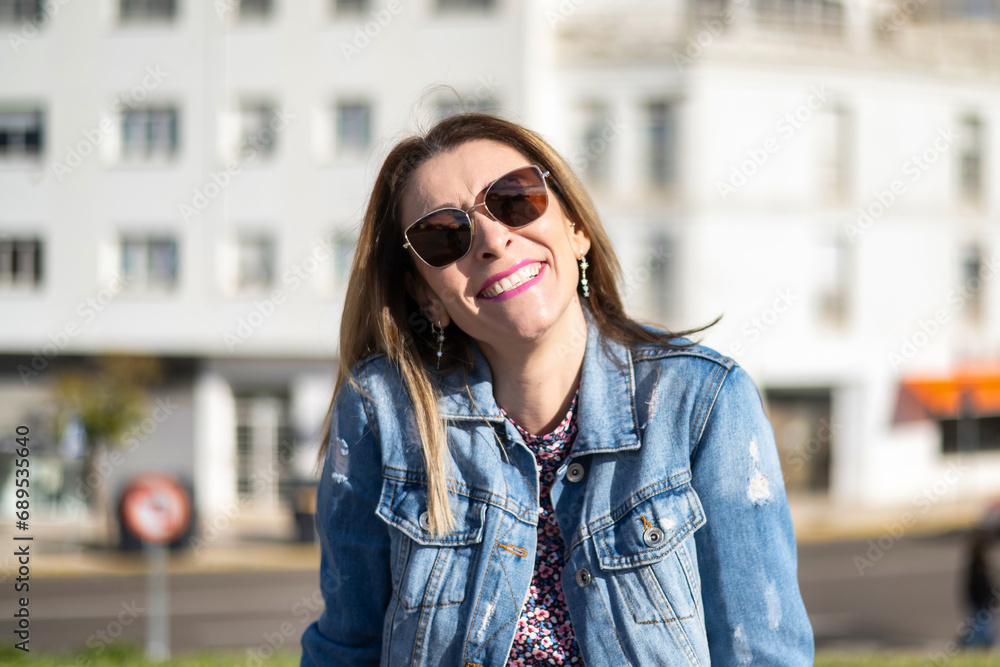 Portraits of a Charming Woman with a Cute Face. Female Posing for the Camera in the City Center. She Has a Wonderful Mood and a Perfect Smile. Portraits of a Charming Woman with a Cute Face. Female Posing for the Camera in the City Center. She Has a Wonderful Mood and a Perfect Smile.