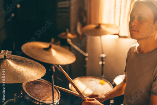 Photography Drummer plays drums in music studio at band rehearsal