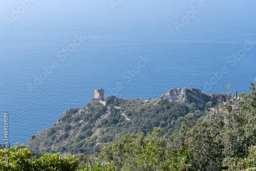 Capo d Uomo old tower and rocky cape on Mediterranean shore  Monte Argentario  Italy