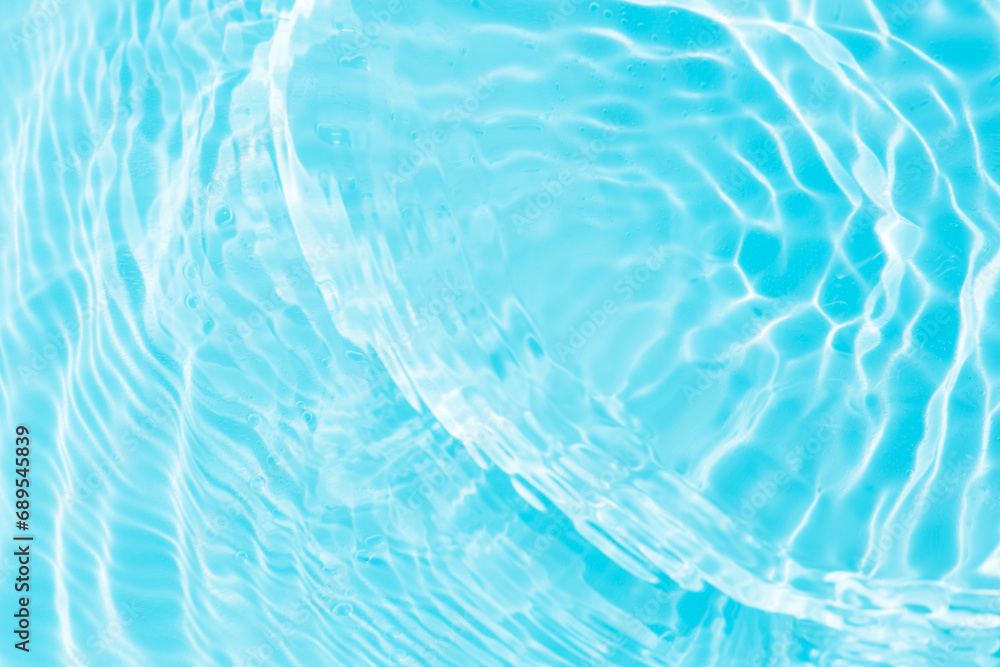 Obraz premium Bluewater bubbles on the surface ripples. Defocus blurred transparent white-black colored clear calm water surface texture with splash and bubbles. Water waves with shining pattern texture background.