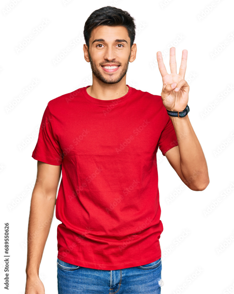 Young handsome man wearing casual red tshirt showing and pointing up with fingers number three while smiling confident and happy. Young handsome man wearing casual red tshirt showing and pointing up with fingers number three while smiling confident and happy.