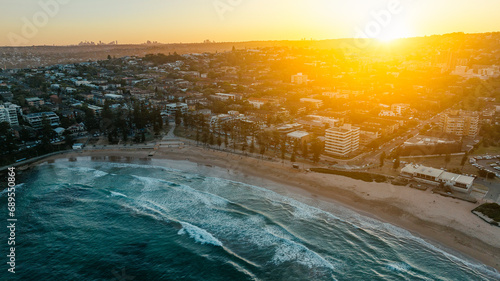Photography Golden glow over a popular north Sydney coastal suburb and beach.