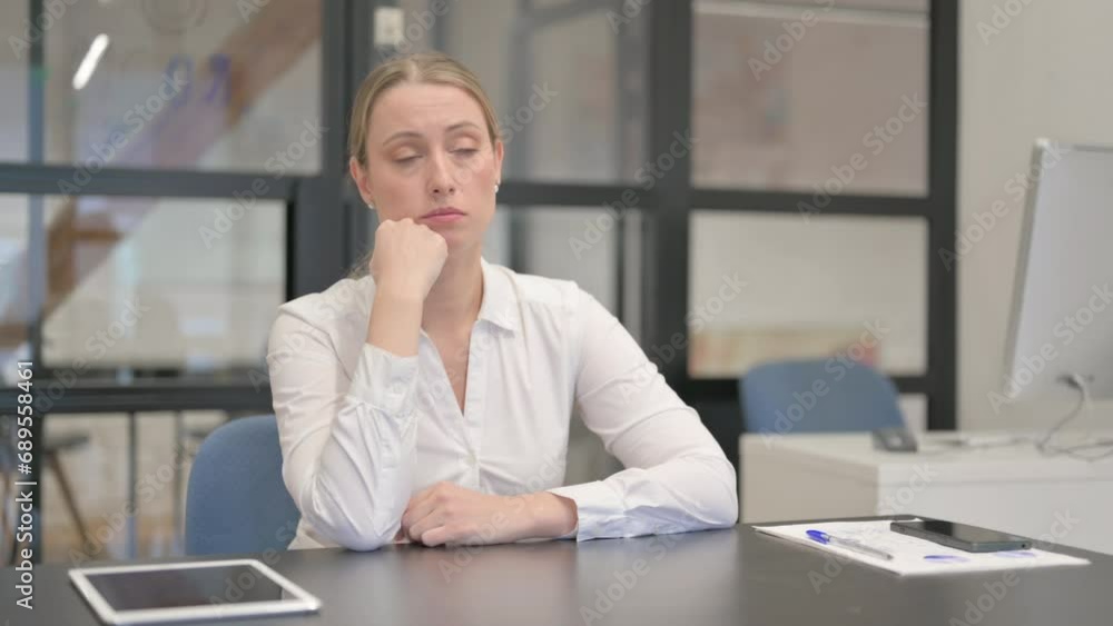 Pensive Mature Business Woman Sitting in Office Pensive Mature Business Woman Sitting in Office