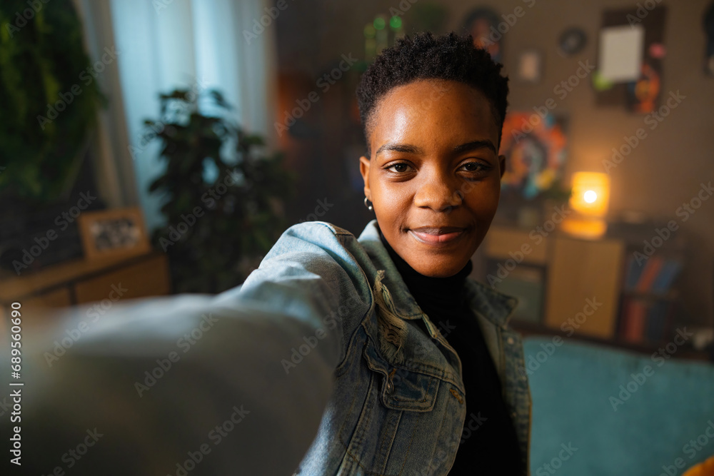Portrait of dark skinned afro american with short haircut having video call with friends family taling happy family concept. Portrait of dark skinned afro american with short haircut having video call with friends family taling happy family concept.