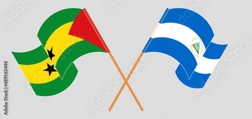 Crossed and waving flags of Sao Tome and Principe and Nicaragua
