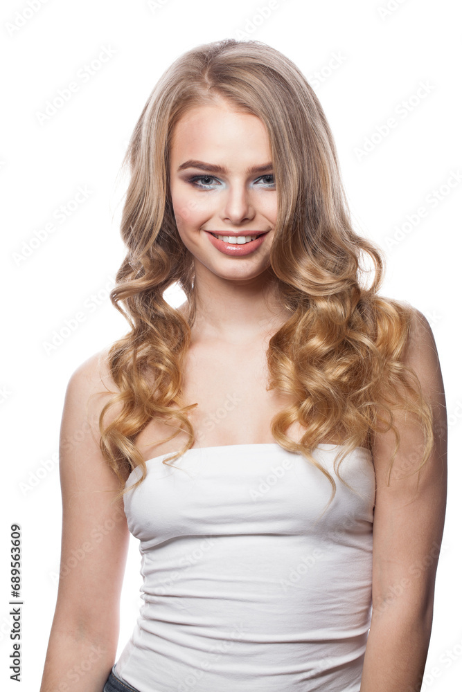 Beautiful woman with makeup and long healthy blonde shiny wavy hair posing against white studio wall background. Emotional fashion beauty portrait Beautiful woman with makeup and long healthy blonde shiny wavy hair posing against white studio wall background. Emotional fashion beauty portrait