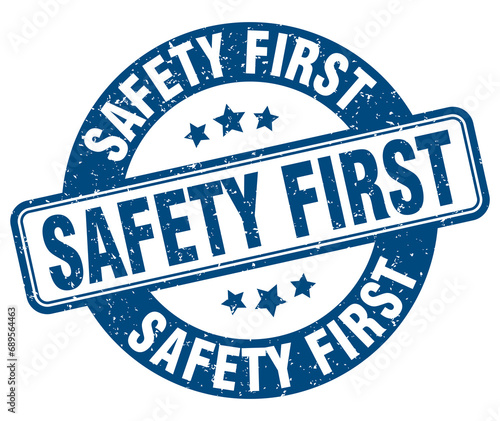 safety first stamp. safety first label. round grunge sign