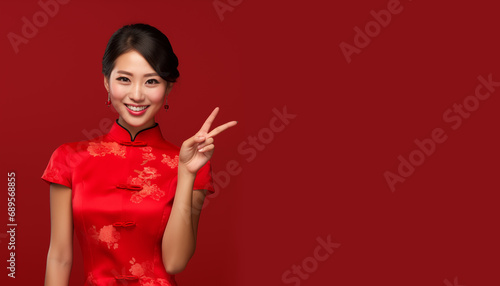 Happy Chinese new year, Asian woman wearing traditional cheongsam qipao dress with congratulation gesture hand on red background, Generative AI photo