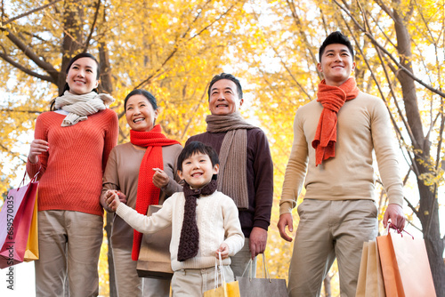 Chinese family shopping in autumn photo