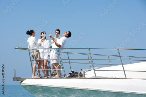 Friends Drinking Champagne on a Yacht photo