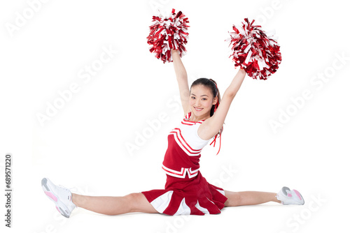 Cheerleader in action with her pom-poms