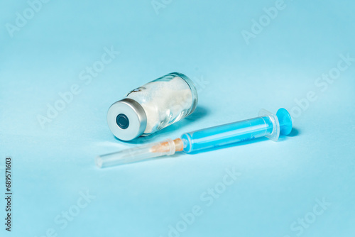 Syringe and needle with glass medical ampoule vials for injection. Medicine is dry white drug penicillin powder or liquid with of aqueous solution in ampulla photo