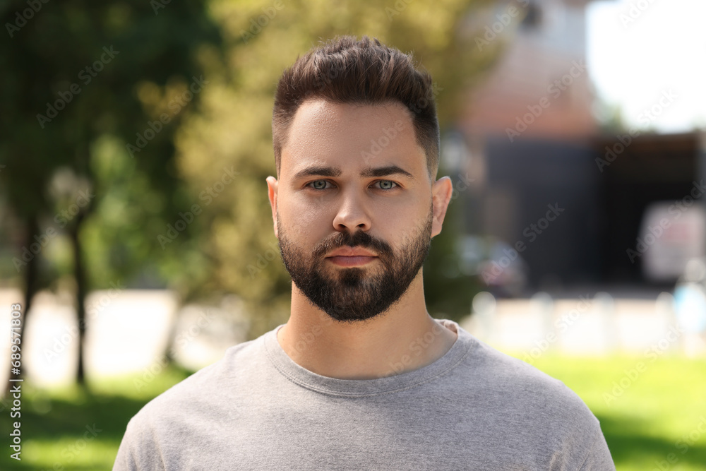 Portrait of handsome young man outdoors on sunny day Portrait of handsome young man outdoors on sunny day