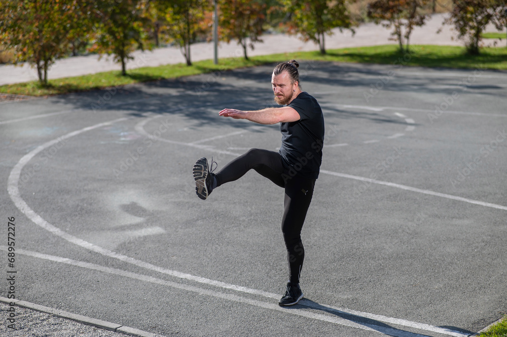 Bearded man doing exercises outdoors. Bearded man doing exercises outdoors.