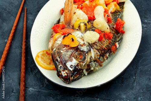 Roasted whole tilapia with citrus sauce.