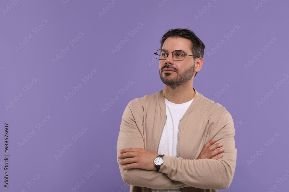 Portrait of man in stylish glasses on violet background, space for text Portrait of man in stylish glasses on violet background, space for text
