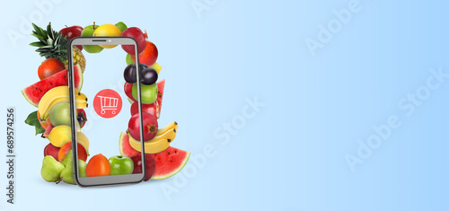 Online purchases. Shopping cart icon and different fruits coming out of smartphone screen on light blue background. Banner design with space for text