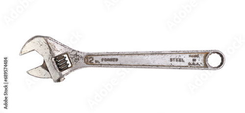 Old adjustable wrench on white background  photo