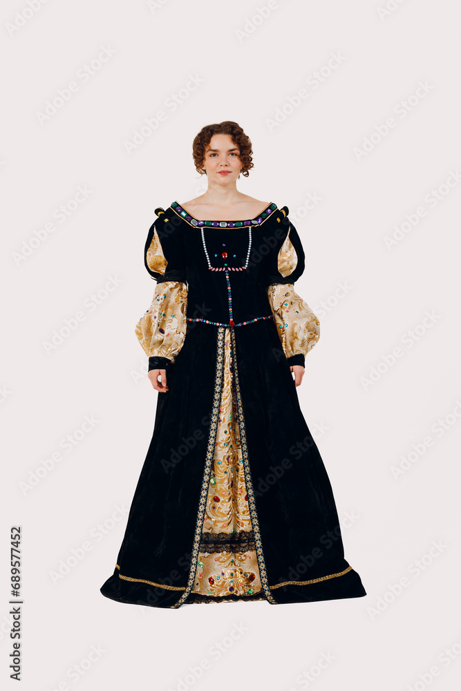 Portrait of a young aristocratic woman dressed in a medieval dress on white background. Front view