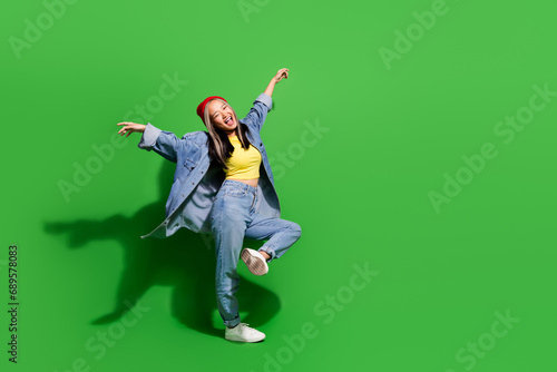 Full length photo of adorable pretty lady wear denim jacket having disco fun empty space isolated green color background