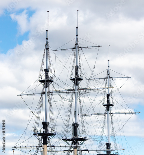 Mast on a ship against the blue sky