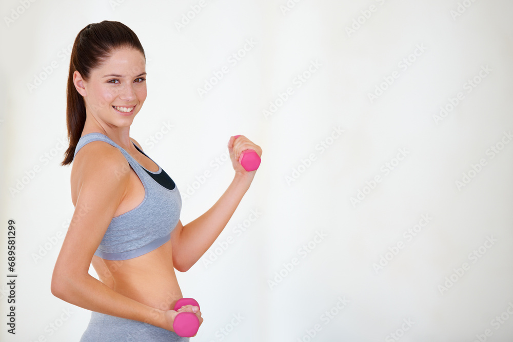 Woman, flex or portrait with dumbbells in studio, health wellness or fitness action for weight loss with exercise. Young person, pride and face with hand weights for tone muscle by white background Woman, flex or portrait with dumbbells in studio, health wellness or fitness action for weight loss with exercise. Young person, pride and face with hand weights for tone muscle by white background