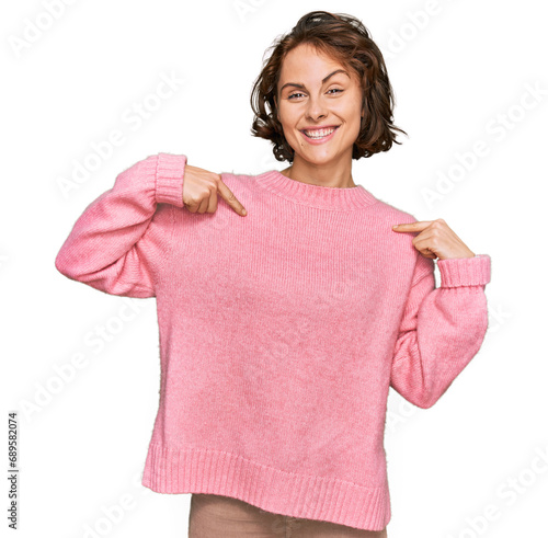 Young hispanic woman wearing casual clothes looking confident with smile on face, pointing oneself with fingers proud and happy.