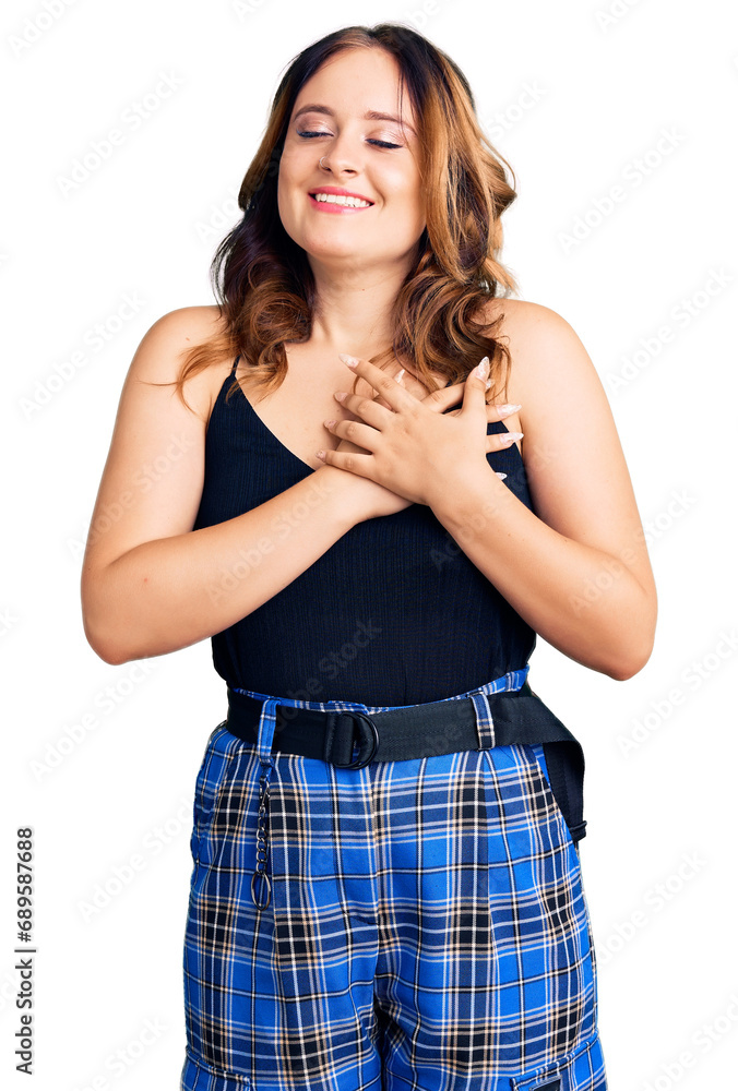 Fototapeta premium Young beautiful caucasian woman wearing casual clothes smiling with hands on chest with closed eyes and grateful gesture on face. health concept.