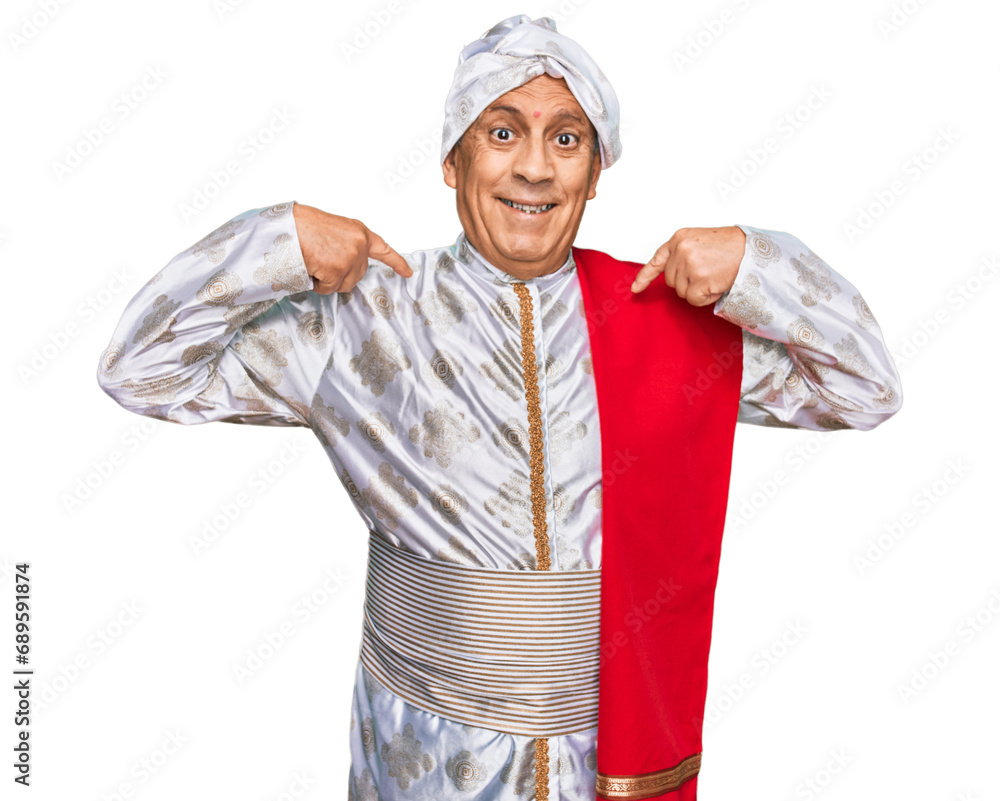 Senior hispanic man wearing tradition sherwani saree clothes looking confident with smile on face, pointing oneself with fingers proud and happy. Senior hispanic man wearing tradition sherwani saree clothes looking confident with smile on face, pointing oneself with fingers proud and happy.