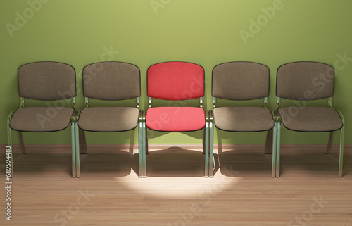 Fotografie An illuminated chair that attracts attention in the middle of empty chairs