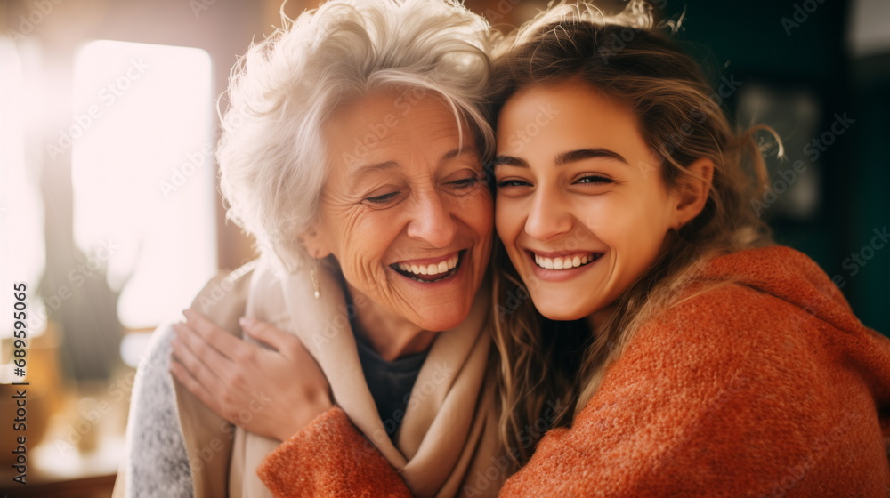 Naklejka premium Lovely smiling happy elderly parent mom with young adult daughter two women together wearing casual clothes hugging cuddle kiss