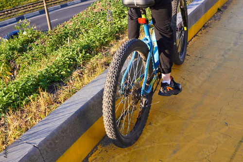 cyclist on a bike path. The rear wheel. Traffic.