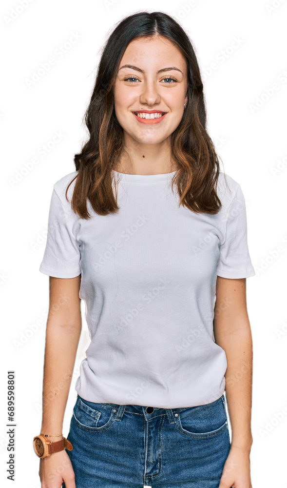 Obraz premium Young beautiful woman wearing casual white t shirt with a happy and cool smile on face. lucky person.