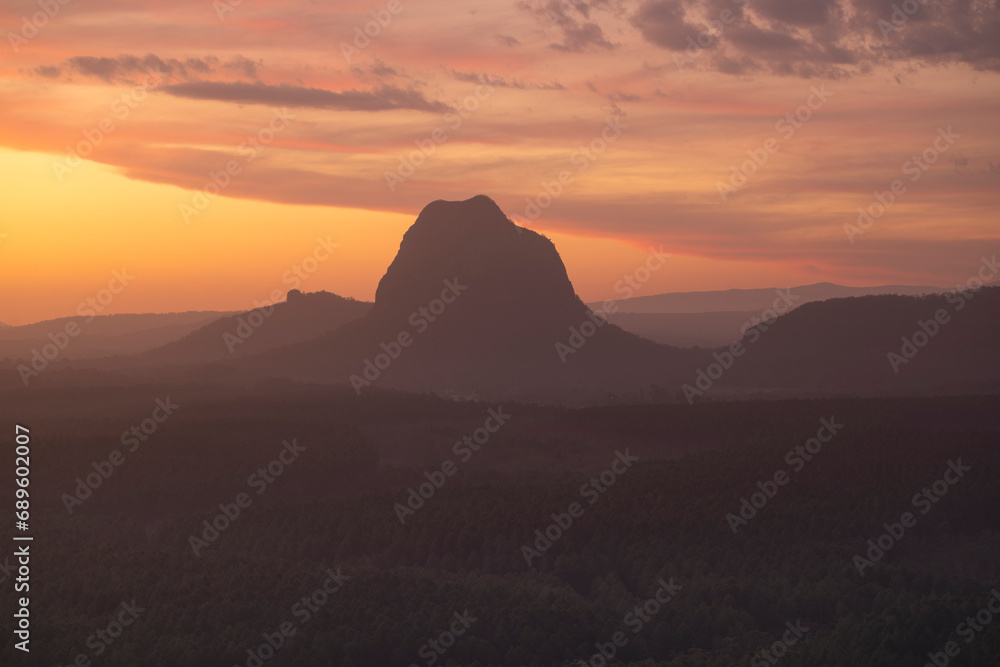 Tourists visit the Wildhorse scenic lookout for sunset panoramic views across the Glasshouse Mountains and the Sunshine Coast in Queensland